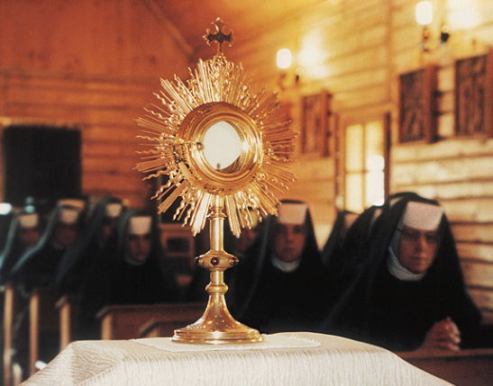 Sisters adoring Jesus in the Blessed Sacrament of the Altar