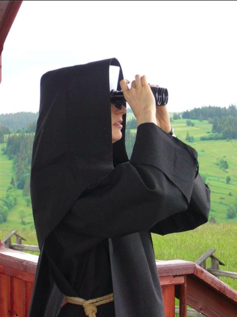 Albertine Sister looking with binoculars